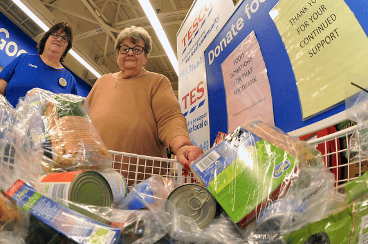 Newton Abbot Tesco community champion Janette Parker and Lin Wooldridge, chair of THAT foodback in Newton Abbot, launch the Tesco’s National Winter Food Collection 2002 which will also be running in the Newton Abbot store this weekend from December 1 to 3