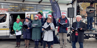 Dog owners and their four legged friends gather for carol service