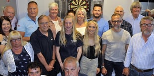 Charity darts team is thrilled to raise £1,000