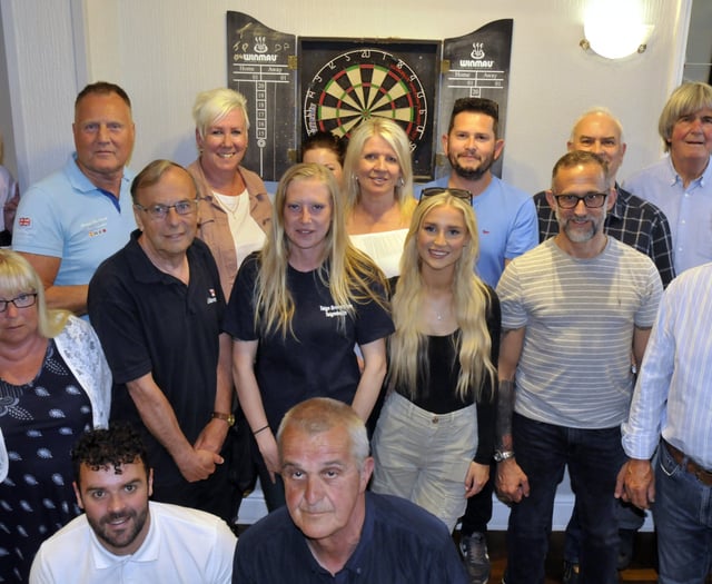 Charity darts team is thrilled to raise £1,000