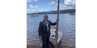 Rowing across the Teign... all in a days work for council Chairman