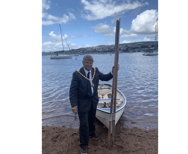 Rowing across the Teign... all in a days work for council Chairman