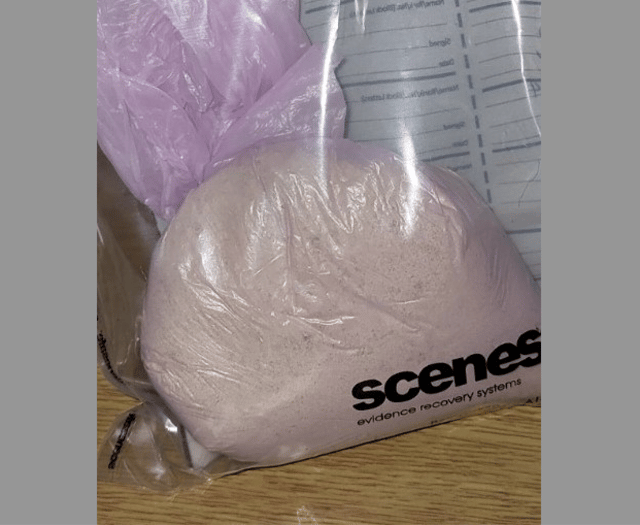 Two arrested after police seize suspected heroin 