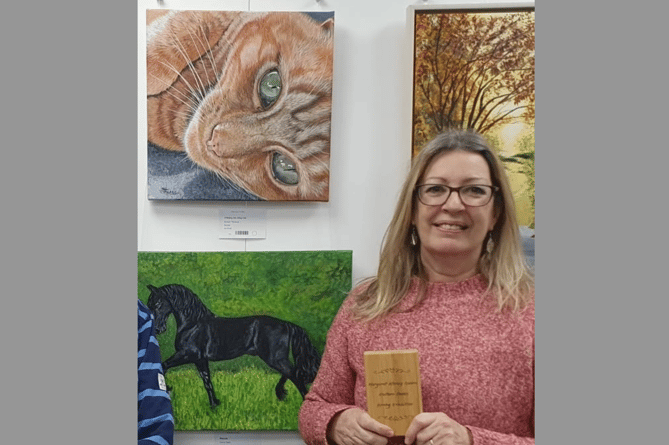 Artist Sue Thomas, the award recipient at the last TAS Exhibition for her painting - ‘O’Malley the Alley Cat’