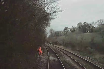 Rail worker missed oncoming train by two seconds, report says 