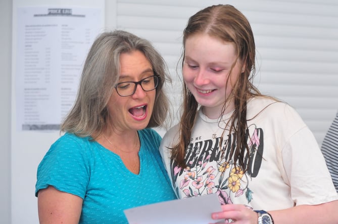 A-Level results day at Teign School, Kingsteignton. 
Moment of truth as Rose Young from Chudleigh opens the envelope, watched by her mum Katie Young
 'I've got A-Level passes in Biology and Maths plus a BTEC in Computer Science,' she excitedly revealed.
"I'll now be heading up to Gloucester University where I'll be studying Biology for the next three years.'