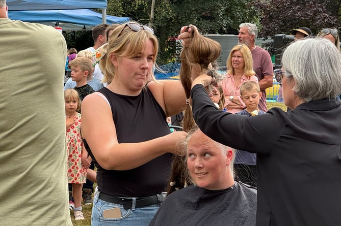 Ruth had hair, which was 170 centimetres long and almost touched her ankles, cut at the event in aid of SNUG Neonatal, her hair donated to Little Princess Trust.  AQ 2042
