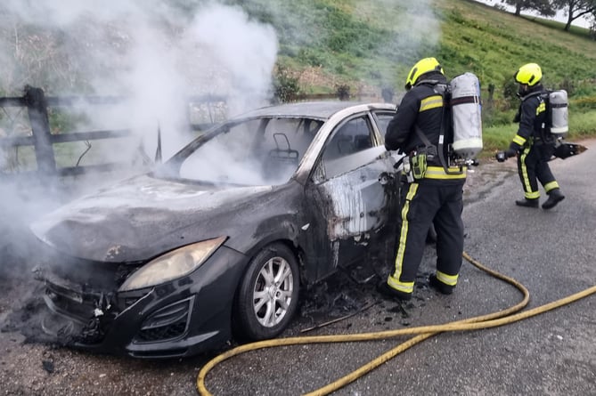 Firefighters from Newton Abbot tackle car fire. Photo Newton Abbot fire station