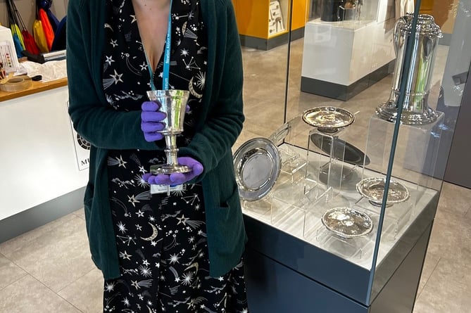 Curator Dr Charlotte Dixon with a piece of silverware on display at Newton Abbot Museum. Photo Nigel Canham 