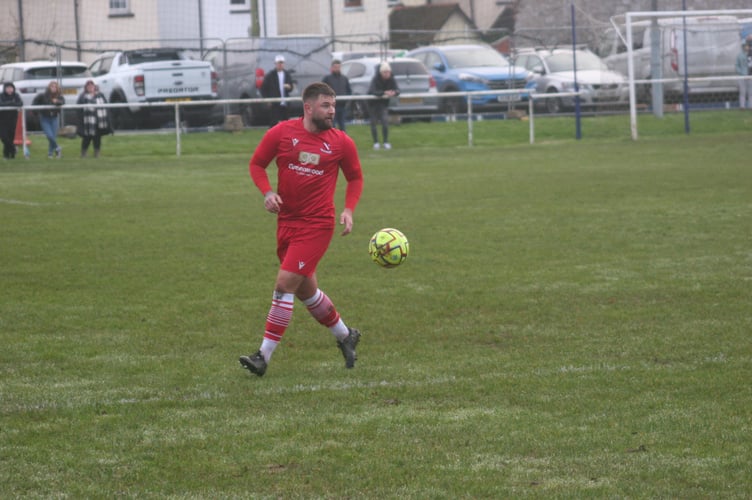 Teignmouth AFC defender in possession